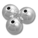 Three reflective silver beads with holes