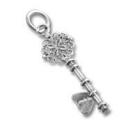 Ornate silver key pendant with heart charm