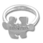 Silver ring with autism puzzle-piece charm