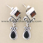Silver dangle earrings with black teardrop stones