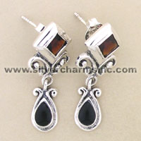Silver dangle earrings with black teardrop stones