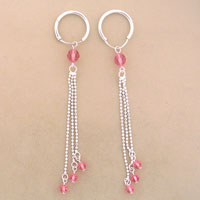 Silver hoop earrings with pink bead tassels