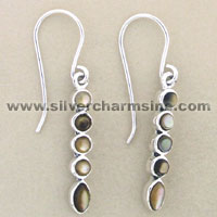 Silver dangle earrings with four oval stones