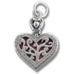 Silver filigree heart pendant with red background