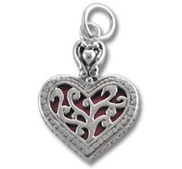 Silver filigree heart pendant with red background