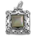 Ornate silver pendant with iridescent square stone