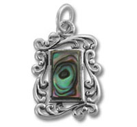 Ornate silver pendant with abalone shell