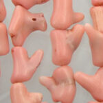 String of pink plastic doll feet