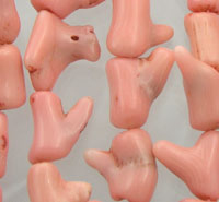 String of pink plastic doll feet
