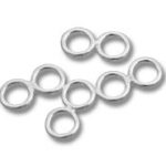 Silver jump rings on white background