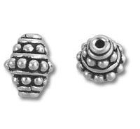 Two ornate silver spacer beads