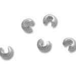Silver crimp bead covers on white background