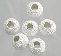 White textured round craft beads with holes