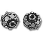 Pair of ornate silver textured round beads