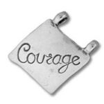 Silver pendant engraved with "Courage