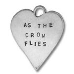 Heart pendant stamped "AS THE CROW FLIES