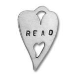 Heart-shaped metal pendant stamped "READ" with cutouts