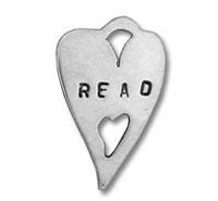 Heart-shaped metal pendant stamped "READ" with cutouts