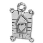 Metal pendant featuring heart-adorned birdhouse charm