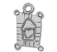 Metal pendant featuring heart-adorned birdhouse charm