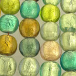 Close-up of green and gold glass pebbles