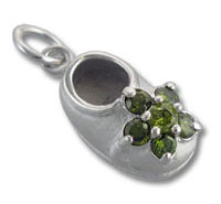 Silver baby shoe charm with green gemstone cluster