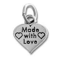 Silver heart pendant stamped "Made with Love