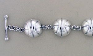 Silver spherical bead bracelet with toggle clasp