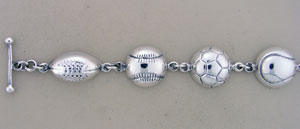 Silver bracelet with sports ball charms