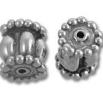 Two ornate silver spacer beads