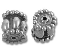 Two ornate silver spacer beads