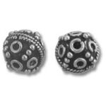 Pair of ornate round silver beads