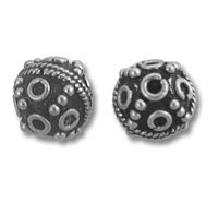 Pair of ornate round silver beads