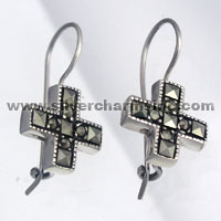 Silver cross dangle earrings with black stones