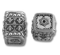 Two ornate silver rectangular beads