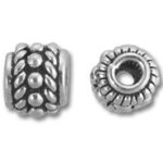 Two ornate silver metal spacer beads