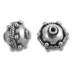 Two ornate silver round decorative beads