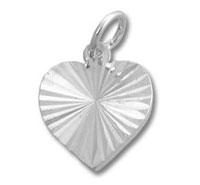 silver heart pendant with starburst engraving