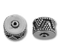 Two silver patterned round metal bead spacers