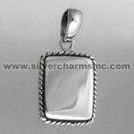 Rectangular silver pendant with twisted rope border