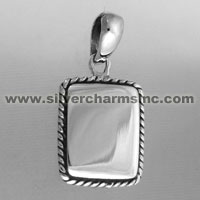 Rectangular silver pendant with twisted rope border