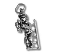 Silver metal charm of a person on ladder