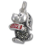 Silver puppy charm holding red LOVE banner