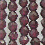 Strands of faceted dark red beads