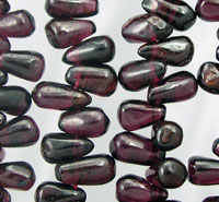 Close-up of dark purple teardrop beads