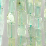 Translucent aqua glass beads arranged vertically