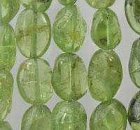 Close-up of translucent green oval beads