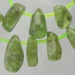 Green gemstone beads on neon green cord