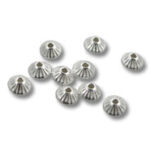 Silver fluted bead caps on white background