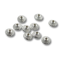 Silver fluted bead caps on white background